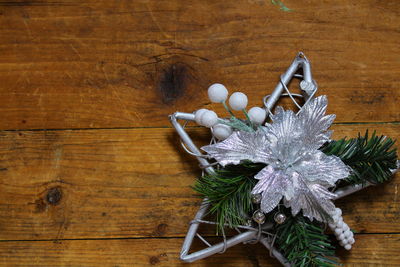 Close-up of christmas decorations on wooden table