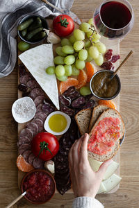 Top view of colorful fresh fruits meat vegetables and sauces for wine in hotel