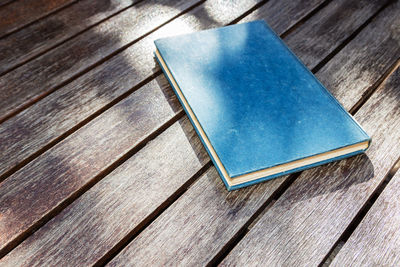 High angle view of blue book on table