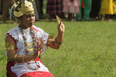 Rear view of woman taditional dancer