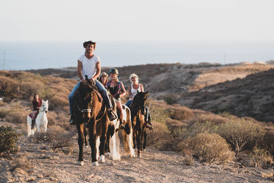 People riding motorcycle on land