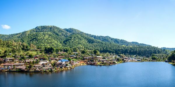 Scenic view of mountains against blue sky