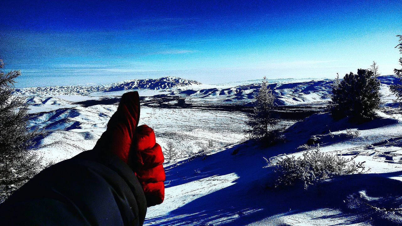 SILHOUETTE OF HAND AGAINST SKY