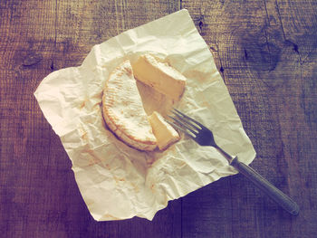 Close-up of cheese on paper