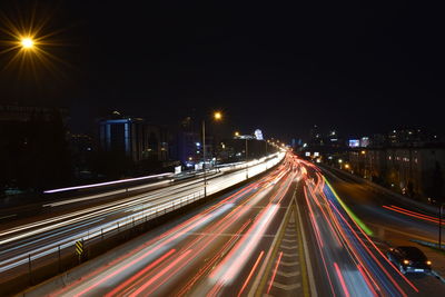 High angle view of light trails on road at night