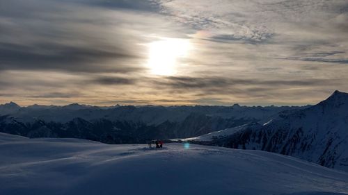 Scenic view of snow covered mountains against sky