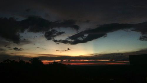 Silhouette landscape against sky during sunset