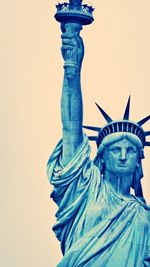 Low angle view of woman standing against wall