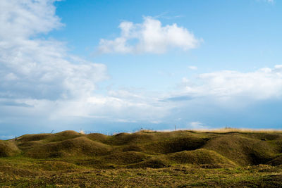 Scenic view of craters landscape against sky