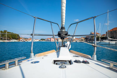 Sailboat sailing on sea against clear sky