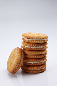 Close-up of snacks over white background