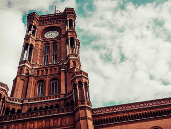 Low angle view of clock tower against sky