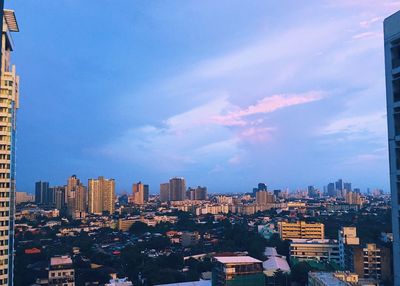 High angle view of buildings in city against sky