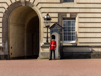 Rear view of man standing in building