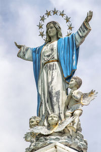 Low angle view of statue against sky