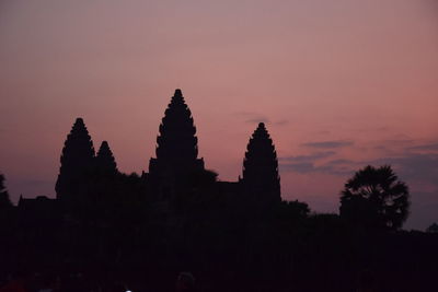 Silhouette of temple against sky during sunset