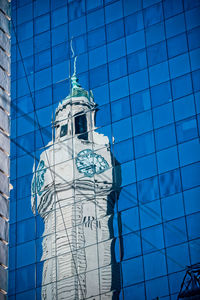 Low angle view of building against blue sky