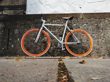 High angle view of bicycle parked on footpath