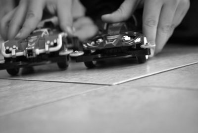 Close-up of hands playing guitar