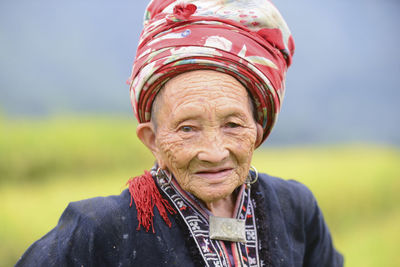 Portrait of mid adult woman against blurred background