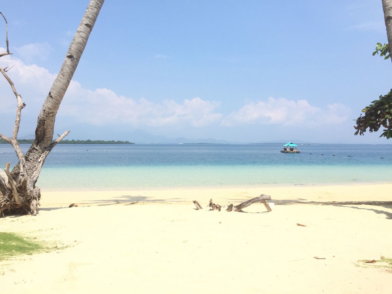 beach, sea, water, tranquility, sky, shore, sand, tranquil scene, horizon over water, scenics, nature, beauty in nature, tree, nautical vessel, boat, idyllic, day, calm, coastline, non-urban scene