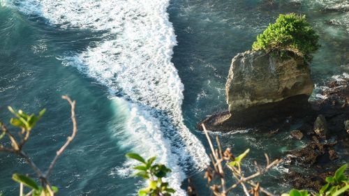 High angle view of rock formation in sea