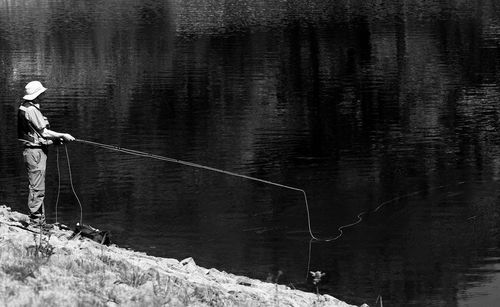 Man fishing in lake