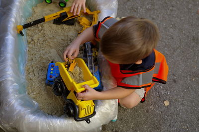 Top shot of toddlers playing in sand