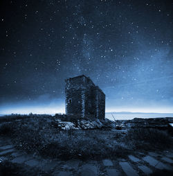 Old building against sky at night