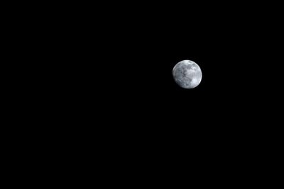 Low angle view of moon against sky at night