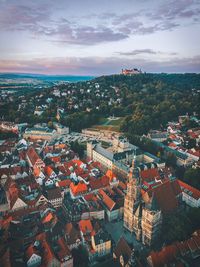 Aerial view of townscape against sky at sunset