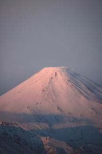 Scenic view of snowcapped mountains against clear sky