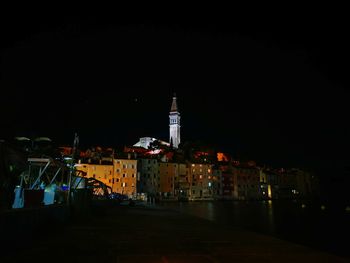 Illuminated buildings in town at night