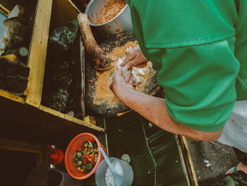 High angle view of man preparing food