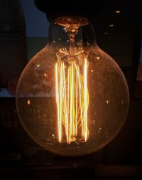 Close-up of illuminated light bulb