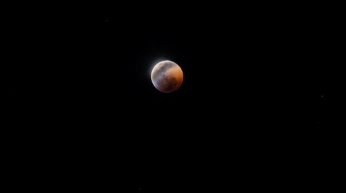 Low angle view of moon against sky at night