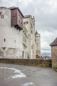 Historic building against sky during winter