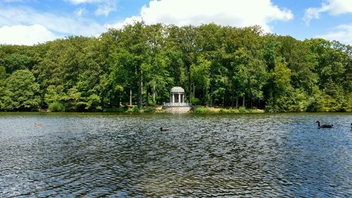 Scenic view of lake against cloudy sky