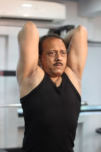Determined man exercising in gym