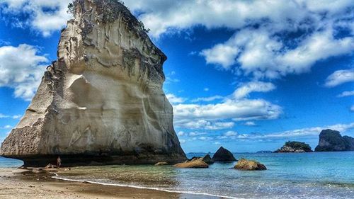 Scenic view of sea against cloudy sky