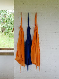 Clothes drying against blue wall