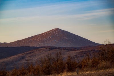 Scenic view of mountains against sky during sunset