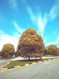 View of road against blue sky and clouds