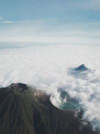 Scenic view of volcanic landscape and cloudscape against sky