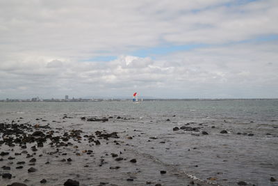 Scenic view of beach against sky