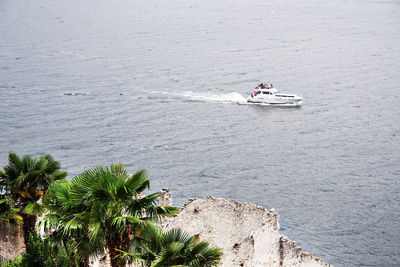 High angle view of people on boat in sea