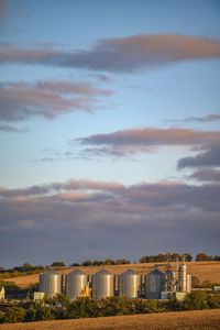Buildings against sky during sunset