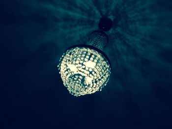 Low angle view of illuminated lamp post at night