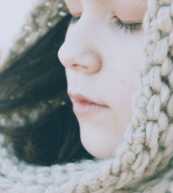Close-up portrait of woman in snow
