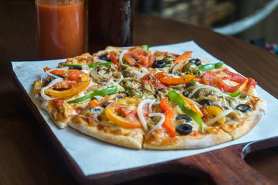 Close-up of pizza served on table